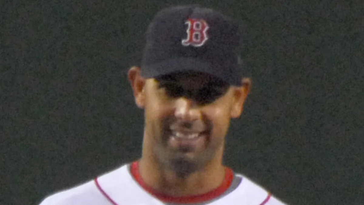 File photo from 24 September 2008: Alex Cora, centre, with the Boston Red Sox at Fenway Park. It was not taken during the 2026 podcast interview.
