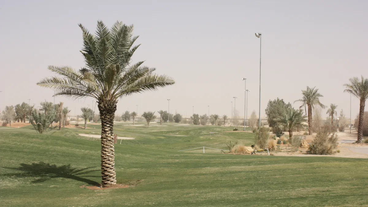 File photo from 13 February 2009: a floodlit desert fairway at a golf course in northern Riyadh, Saudi Arabia. It does not show the 2026 PIF Saudi International or its tournament set-up. The 16:9 cropped derivative is offered under the same CC BY 3.0 licence.