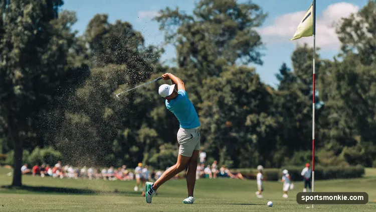 A beginner golfer noting a high score on a scorecard beside a golf cart on a sunny fairway