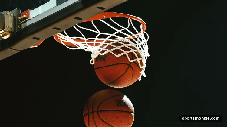 Player running a spot-up shooting drill with a partner rebounding under the rim