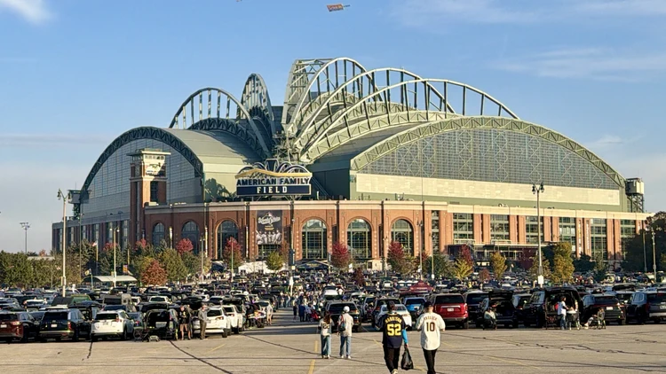 File photo from 25 October 2026: the exterior of American Family Field in Milwaukee before Game 2 of the 2026 World Series, with fans tailgating outside. It was not taken at the Game 5 clincher in Tampa Bay.