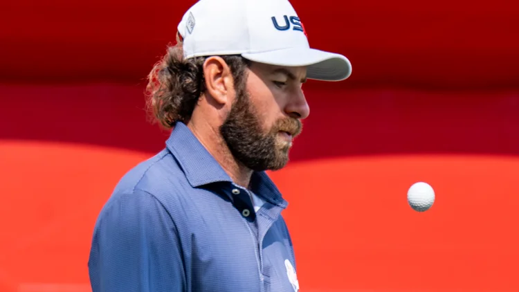 File photo from September 2025: Cameron Young at the Ryder Cup, tossing a golf ball. It was not taken in 2022. Licensed under CC BY-SA 4.0.