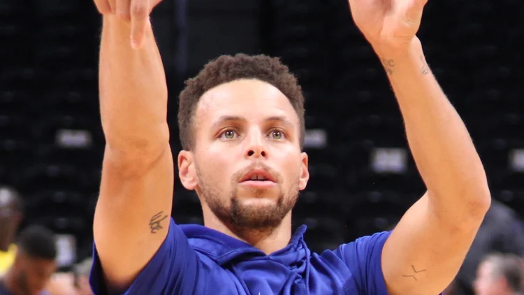 File photo from 4 November 2017: Stephen Curry in a Golden State warm-up top practicing in Denver. It was not taken at the Lakers game and does not show the Doncic play.