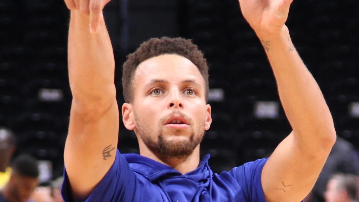 File photo from 4 November 2017: Stephen Curry in a Golden State warm-up top practicing in Denver. It was not taken at the Lakers game and does not show the Doncic play.