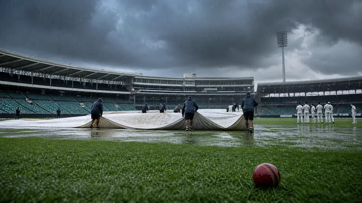 A rain-covered cricket pitch with covers on, representing a DLS-affected match