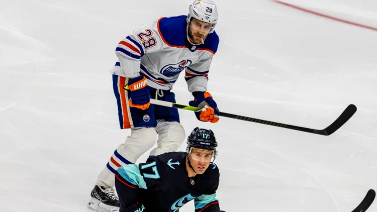 File photo from 18 March 2023: Leon Draisaitl of the Oilers with Jaden Schwartz of the Kraken. It was not taken at the Leafs game in Edmonton.
