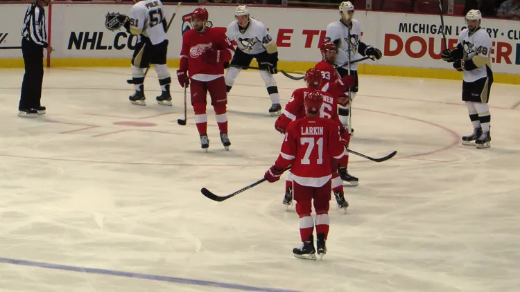 File photo from 24 September 2015: Dylan Larkin, back to camera in the No. 71 Red Wings jersey, at Joe Louis Arena against Pittsburgh. It was not taken at the 2026 sit-out and does not show the trade talks.