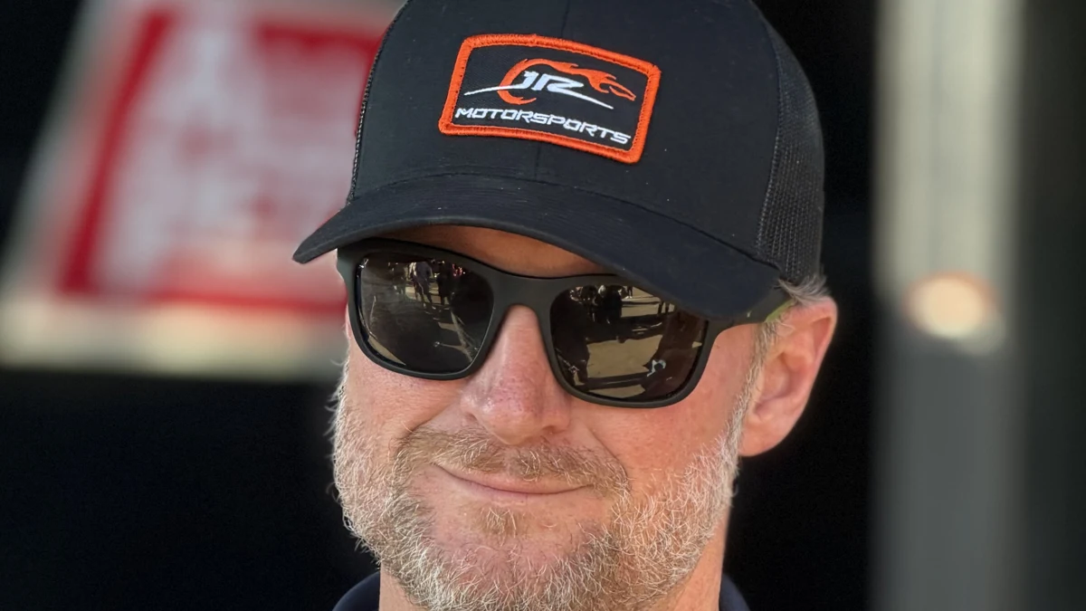 File photo from November 2025: Dale Earnhardt Jr. in a JR Motorsports cap and sunglasses at Phoenix. It does not show Greensboro or any traffic stop. Cropped 16:9 derivative offered under the same CC BY 4.0 licence as the original.