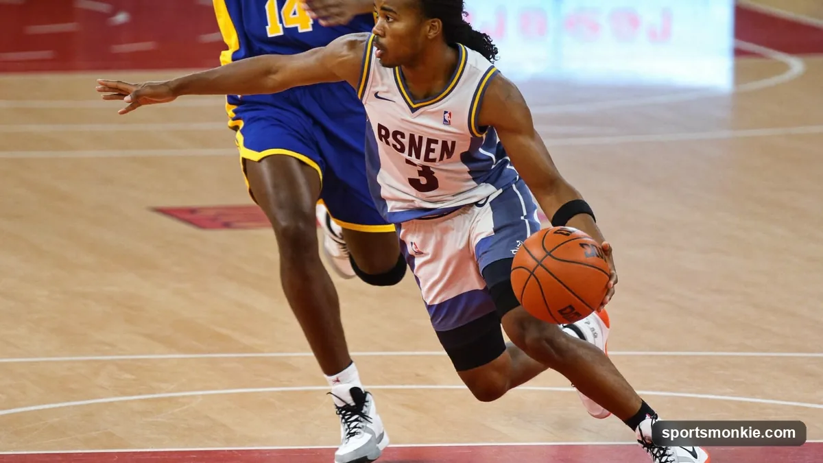 Basketball player driving to the basket and planting one foot to step laterally past a defender during a euro step