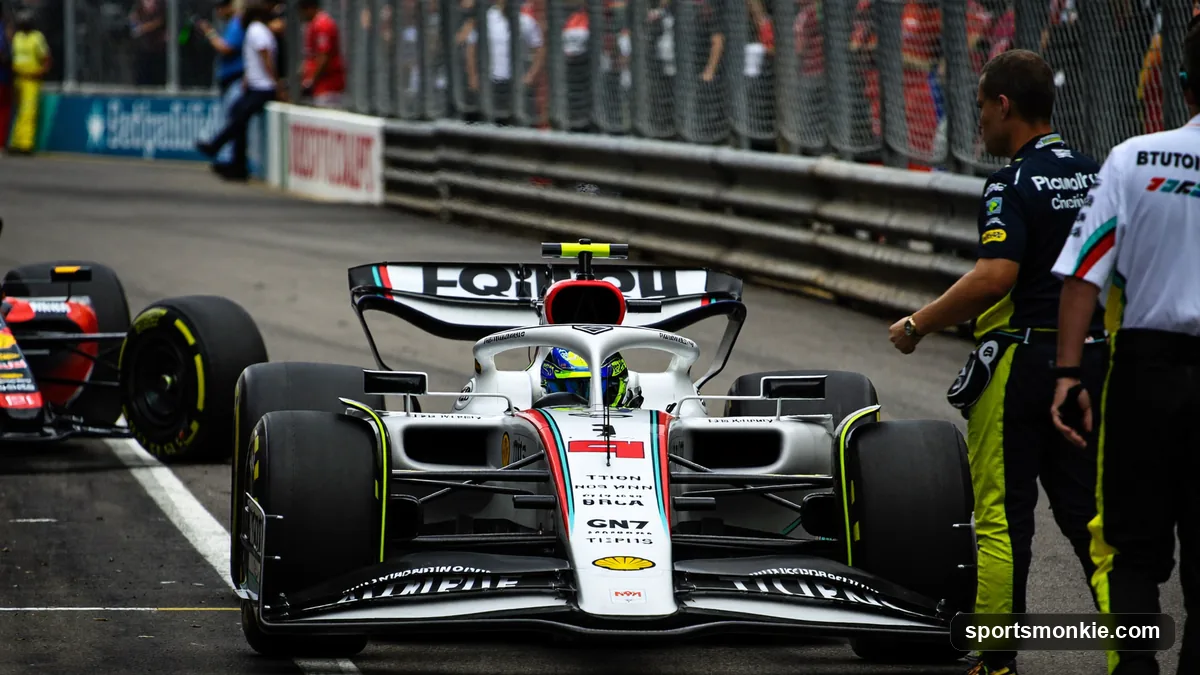 An F1 car serving a penalty in the pit lane with stewards' timing equipment visible