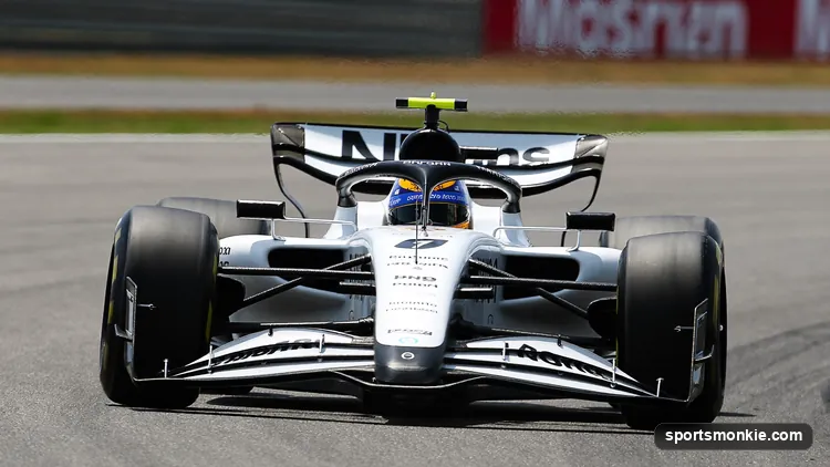 A Formula 1 car on a flying qualifying lap with the timing screen showing session positions