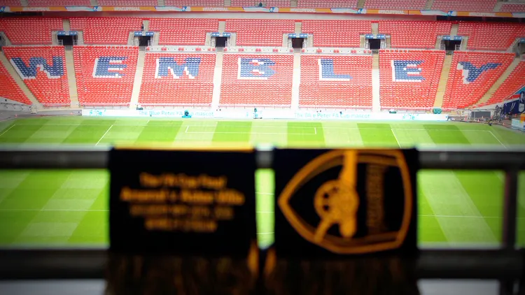 File photo from the 2015 FA Cup final: Wembley Stadium with the WEMBLEY lettering spelled out in the seats. It does not show the 2026-27 first round.