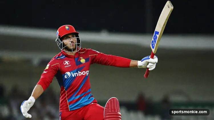Batsman pulling a short ball to the boundary in a limited-overs match under lights