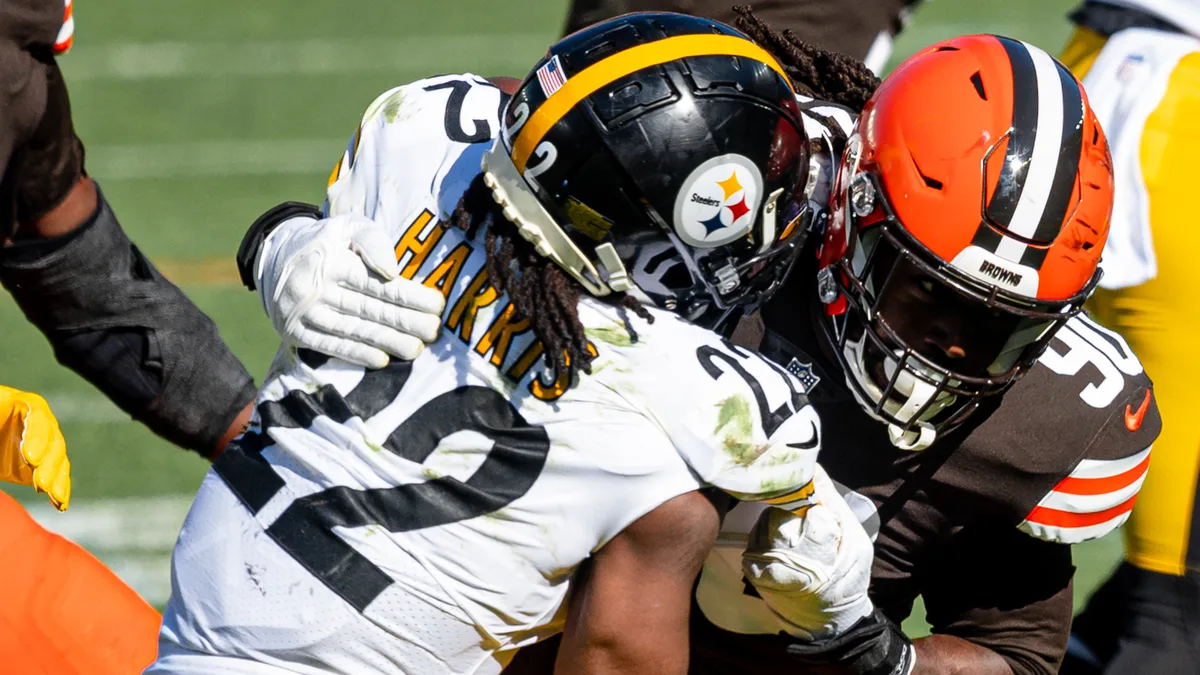 File photo from October 31, 2021: Najee Harris of the Pittsburgh Steelers is tackled by Cleveland's Jadeveon Clowney. It predates his Giants stint and does not show Sunday's game against New Orleans.