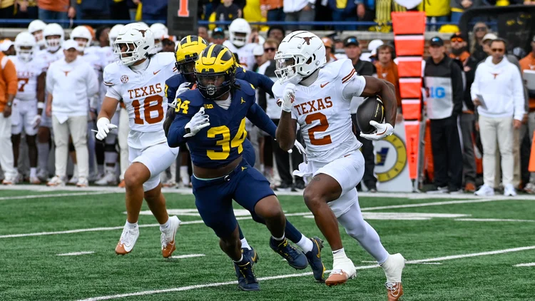 File photo from 7 September 2024: Matthew Golden of Texas carrying the ball against Michigan. It was not taken at the Packers-Panthers game and does not show the scuffle or the referee.