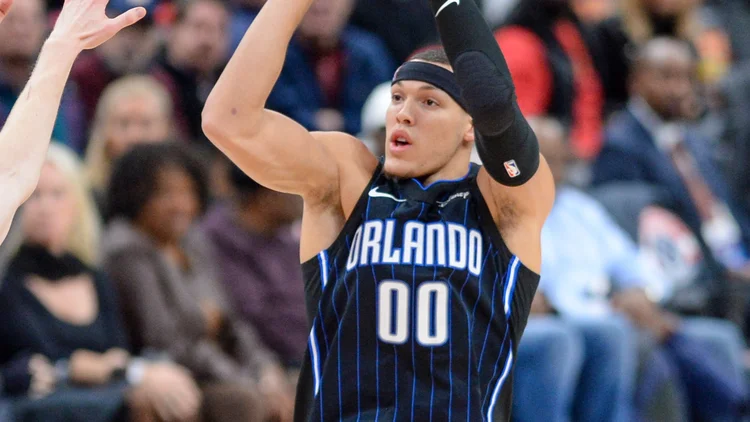 File photo from 3 December 2019: Aaron Gordon in his Orlando Magic No. 00 jersey shooting over Davis Bertans. It was not taken at Monday night's Warriors-Nuggets game.