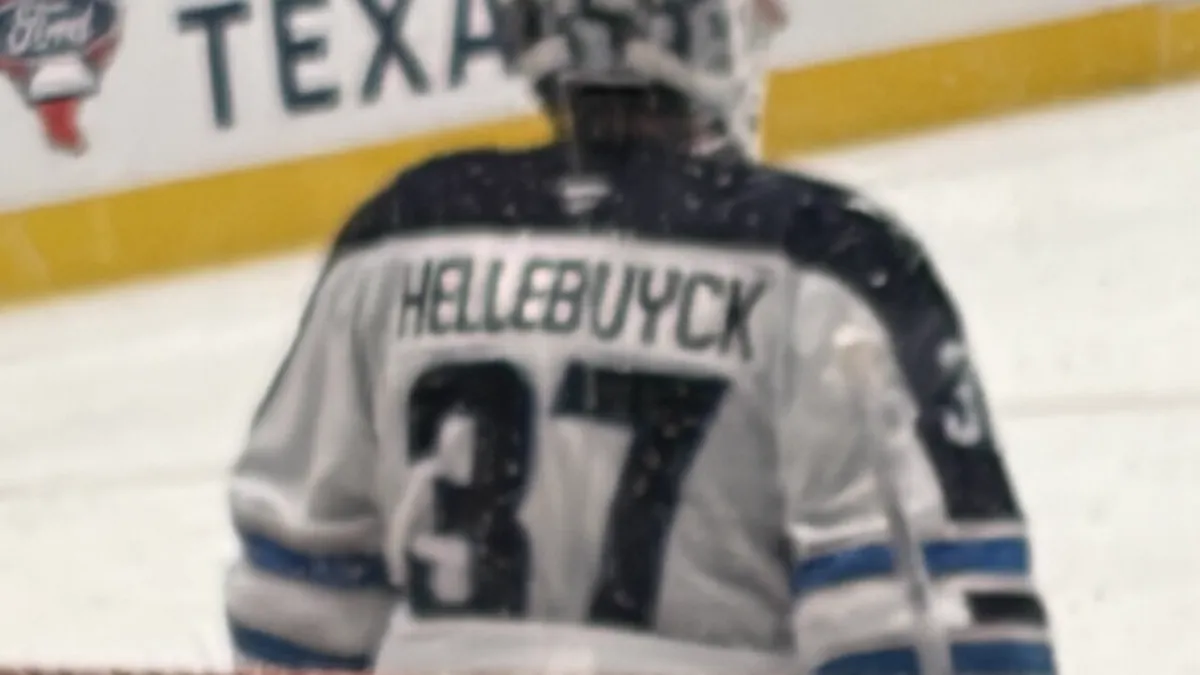 File photo from April 2026: Winnipeg Jets goaltender Connor Hellebuyck. It was taken months before the trade request and suspension, and is used to identify the player, not to show Thursday's reported agreement. Released under CC0.