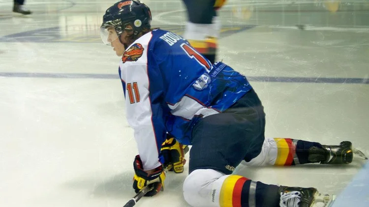 File photo from 16 August 2013: Hayden Hodgson stretching during pre-game warm-ups for the Erie Otters. It was not taken in Los Angeles and does not show the boarding hit on Brandt Clarke.