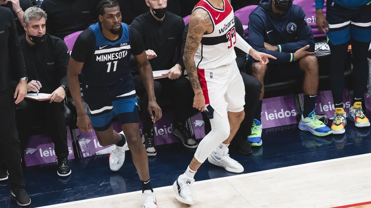 File photo from 1 December 2021: Naz Reid, in Minnesota's No. 11 jersey, walks past the Timberwolves bench during a game against Washington. It was not taken at the Detroit game and does not show the benching.