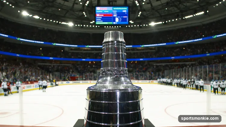 The Stanley Cup on display with a playoff bracket concept in the background
