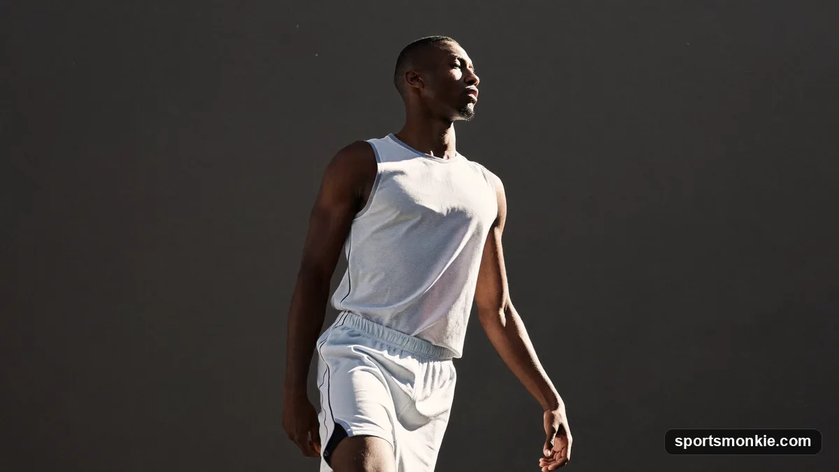 Player releasing a jump shot with high arc and locked follow-through wrist