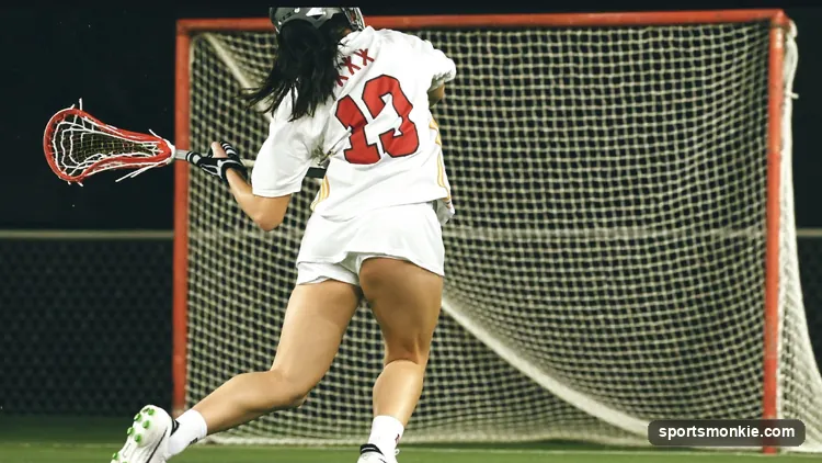 A lacrosse player rotating the hips and shoulders to generate a fast shot