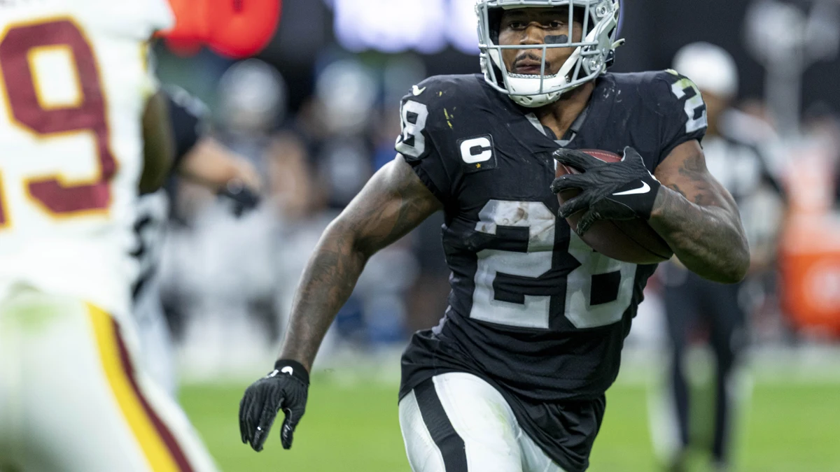 File photo from 5 December 2021: Josh Jacobs carrying the ball for the Las Vegas Raiders against Washington at Allegiant Stadium. It was not taken at Green Bay and does not show the Carolina game or the touchdown celebration.