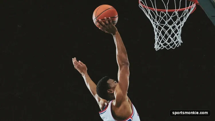 Basketball player elevating into a jump shot with elbow aligned under the ball at the set point