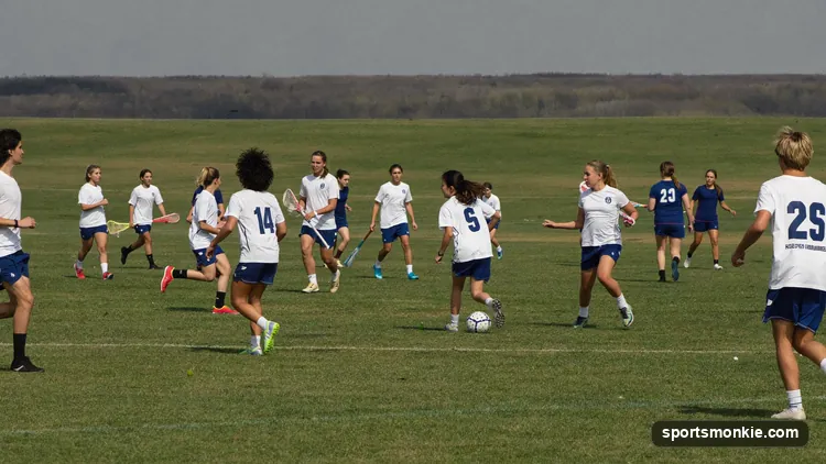 A youth lacrosse game on a well-kept field in a lacrosse hotbed region