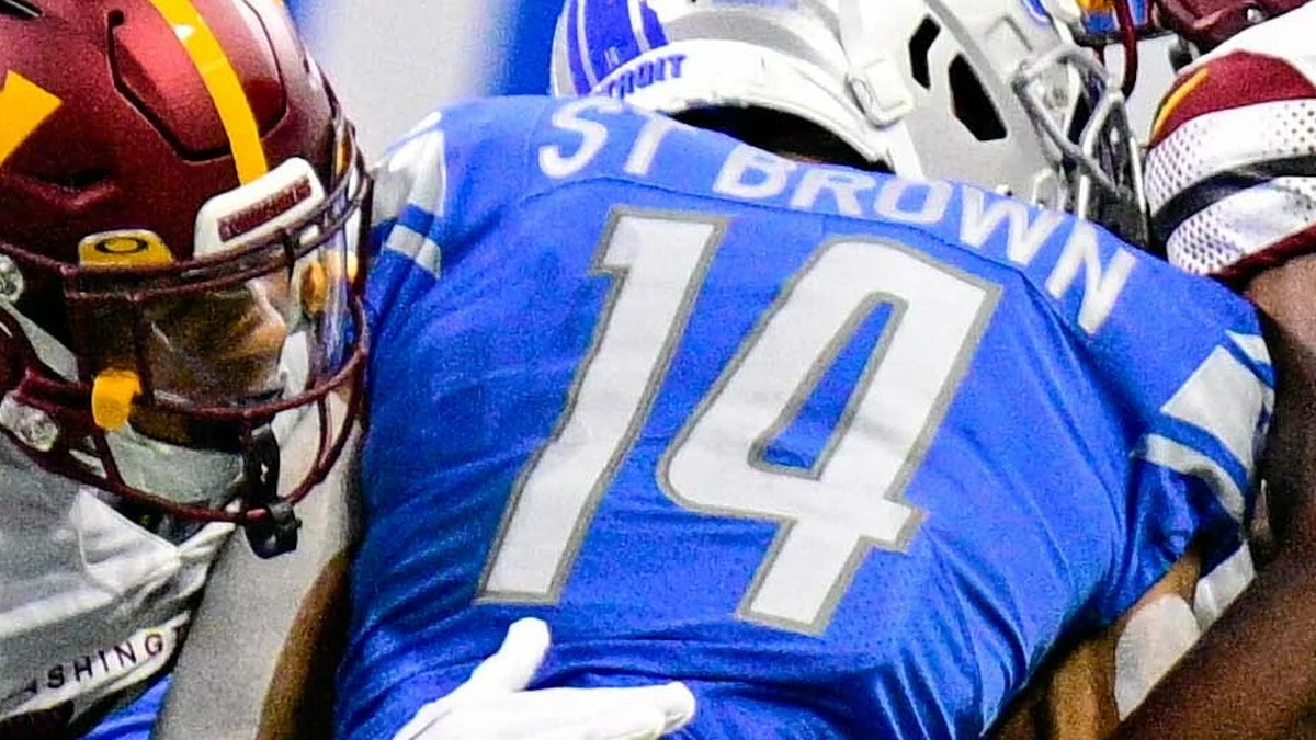 File photo: Amon-Ra St. Brown (No. 14) running with the ball against Washington at Ford Field on September 18, 2022. This is not a photo from the October 25, 2026 game against Green Bay.