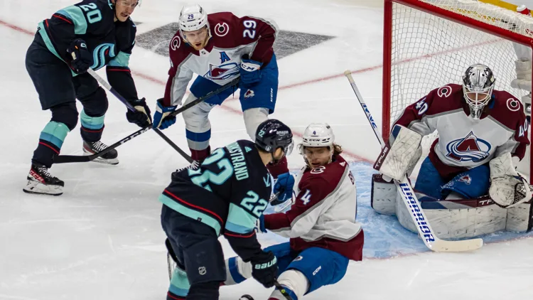 File photo from April 24, 2023: Nathan MacKinnon, centre, in a Colorado Avalanche uniform during a playoff game in Seattle. It does not show the Dallas game, and the cropped derivative is offered under the same CC BY-SA 2.0 licence as the original.
