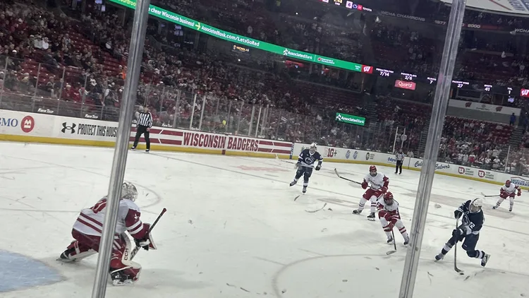 File photo from January 2026 of Gavin McKenna playing for Penn State against Wisconsin at the Kohl Center, shooting on goal as he completes his first collegiate hat trick. It does not show Monday's Maple Leafs game against San Jose. The 16:9 cropped derivative is offered under the same CC BY-SA 4.0 licence.