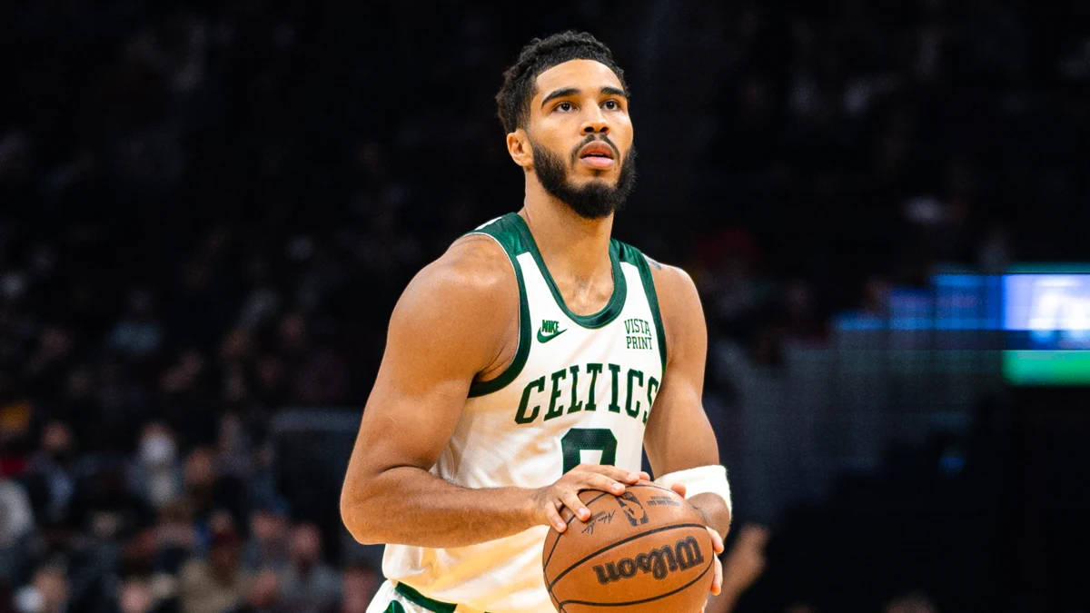 File photo of Jayson Tatum in a Celtics jersey holding a basketball. It was not taken at TD Garden on October 27 and does not show the buzzer-beater or the Nets game.