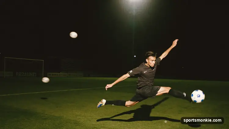 Soccer striker celebrating a goal under Champions League stadium floodlights