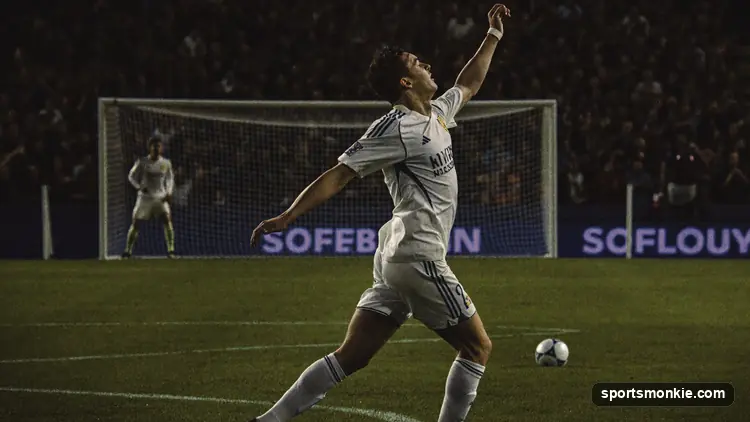 Soccer striker celebrating a goal in front of a packed stadium crowd