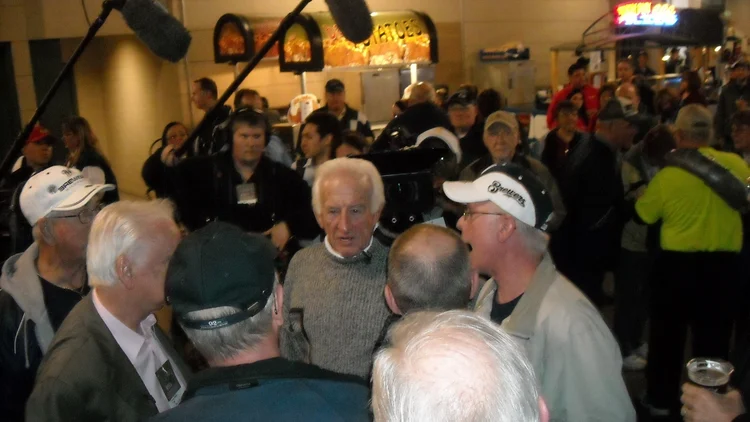 File photo from 26 April 2011: Brewers broadcaster Bob Uecker at Miller Park in Milwaukee. It does not show the 2026 NLCS or Jeff Levering's final call. The 16:9 cropped derivative is offered under the same CC BY 2.0 licence.