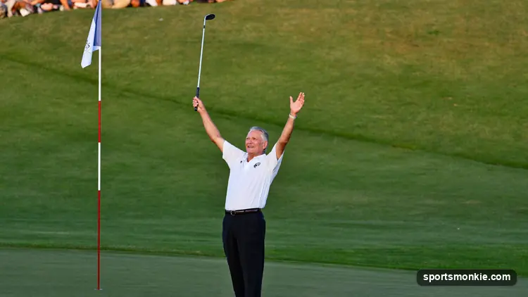 Veteran golfer celebrating a putt on the 18th green at a major championship