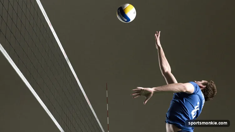 Volleyball opposite hitter attacking from the right side of the net at zone 2