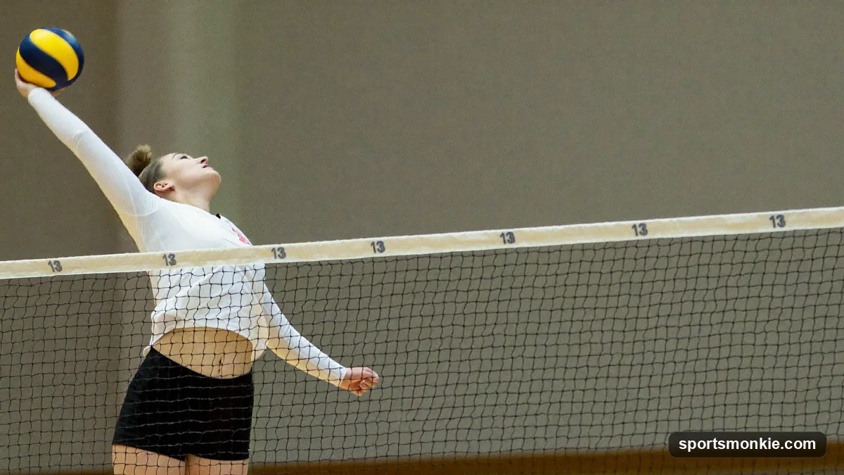 Outside hitter jumping to attack a high set from the left side of the volleyball court