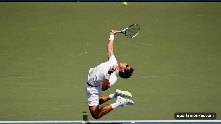 Tennis player striking an overhead smash above their head near the net