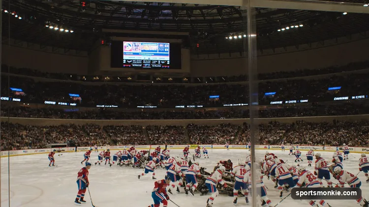 NHL players racing up the ice during a three-on-three overtime period