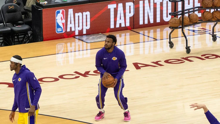 File photo from January 2026: Bronny James in Lakers warm-ups holding a ball during pregame at Cleveland. It does not show the Golden State preseason game. Cropped 16:9 derivative of the original photograph.