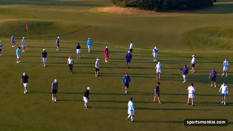 Multiple golf groups positioned on different holes across a course ready to tee off at once