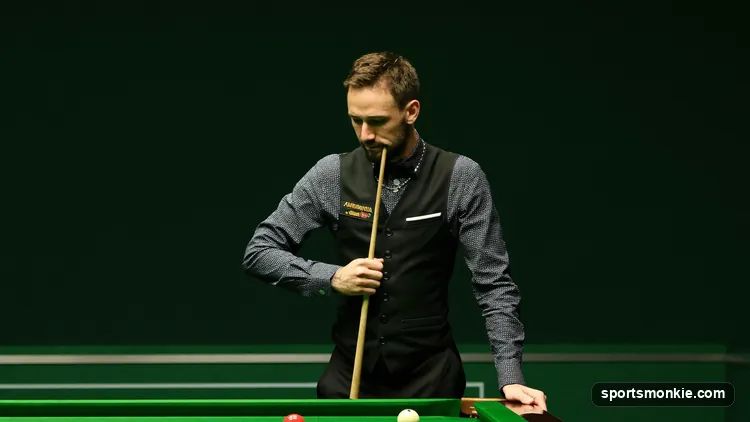 A snooker referee re-spotting a colour after a foul during a frame