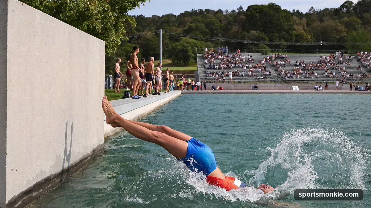 Steeplechase runners clearing the water jump barrier at a track and field meet
