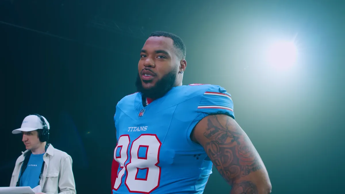 File photo from 13 March 2026: Jeffery Simmons in a light blue Tennessee Titans No. 98 jersey at a team photo shoot. It was not taken after the trade and does not show him in a Bears uniform.