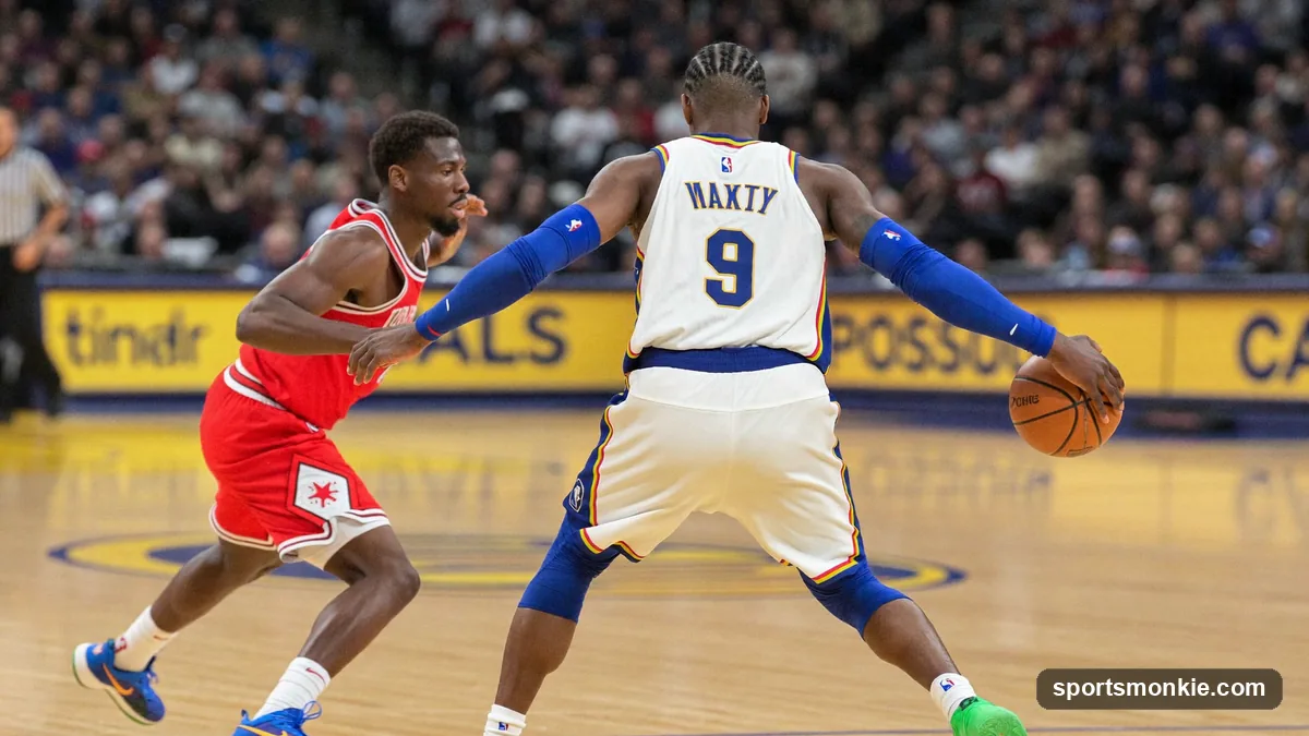Basketball defender taking a charge as an offensive player drives into him under the basket