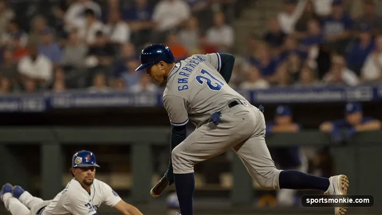 Infielder stepping on second base to complete a force out on a baserunner in a baseball game