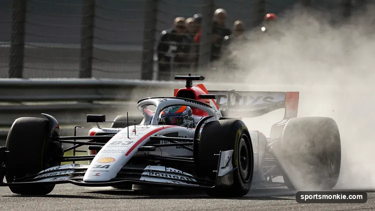 Two Formula 1 cars running nose to tail with turbulent air rising off the leading car