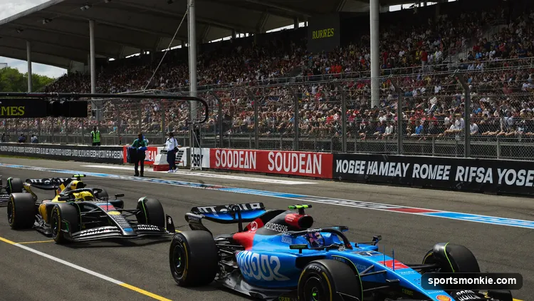 Formula 1 cars lined up on the grid for a Saturday Sprint race under bright daylight